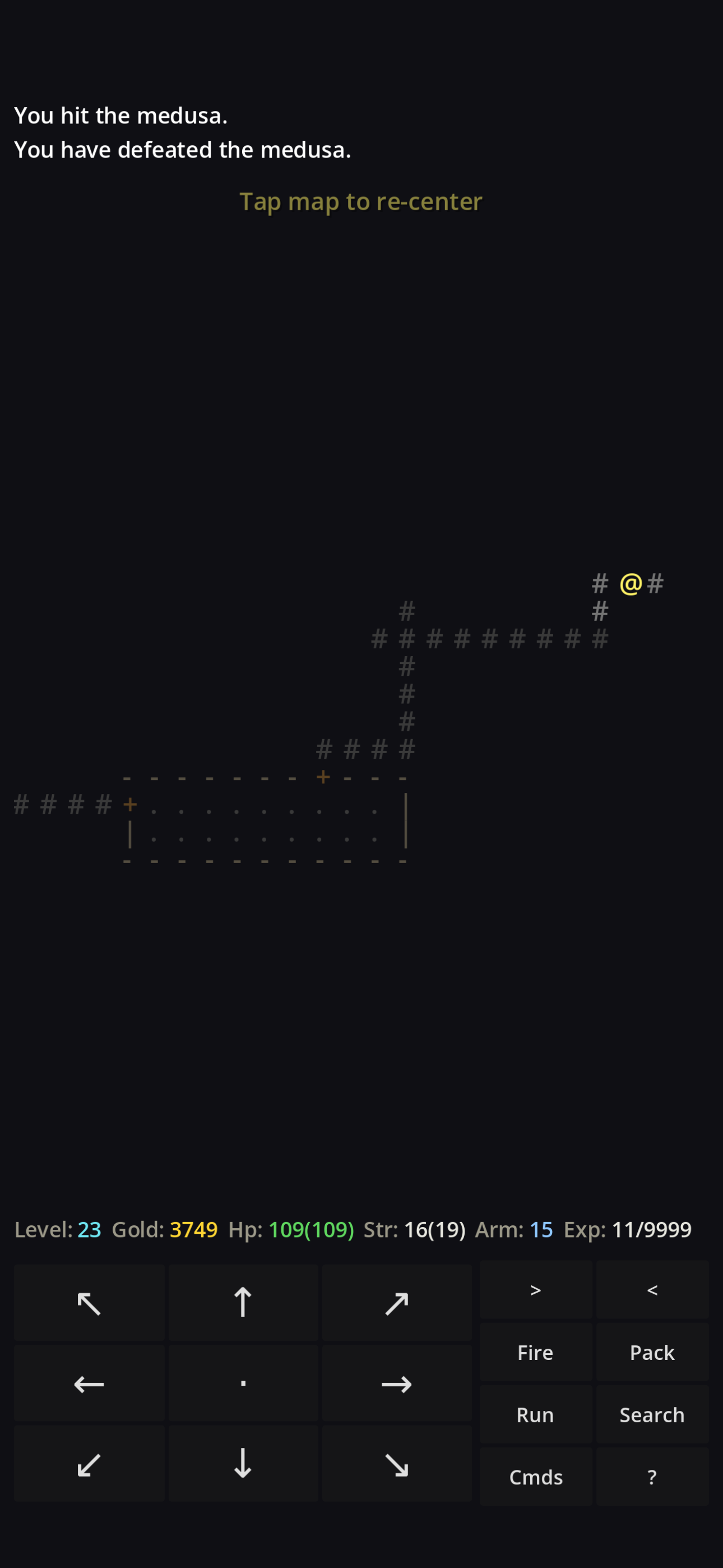 Direhollow on a phone: corridors branch across the level, the hero @ near a junction, with the message &ldquo;You hit the medusa. You have defeated the medusa.&rdquo; above and the on-screen controls below.